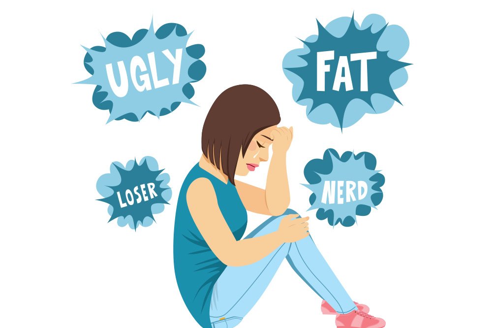 Vector image of a young woman sitting down crying with the words ugly, fat, loser, and nerd floating around her